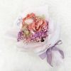 bouquet with money rose, ferrero rocher and coloured baby’s breath in pink wrapping with purple ribbon.
