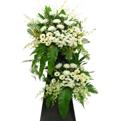 condolences flower stand featuring white chrysanthemums, gerberas, orchids, and lush greenery arranged in two tiers.