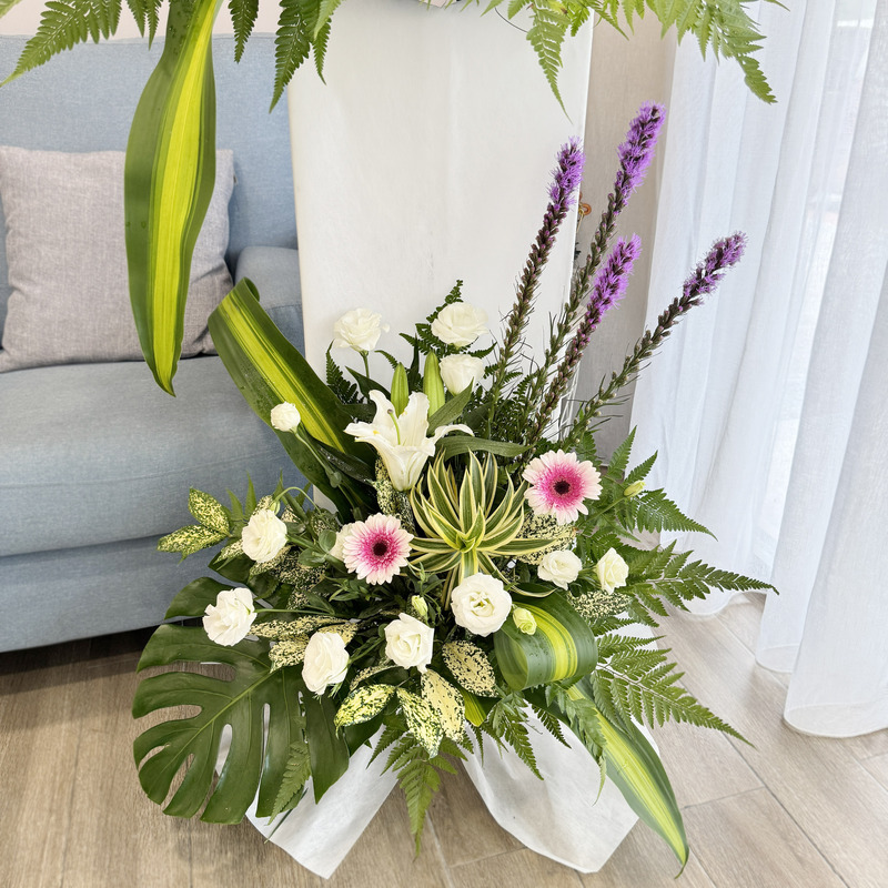 condolences flower stand with pink gerbera, white eustoma, casablanca lily and vertical liatris stems arranged in a 175cm stand