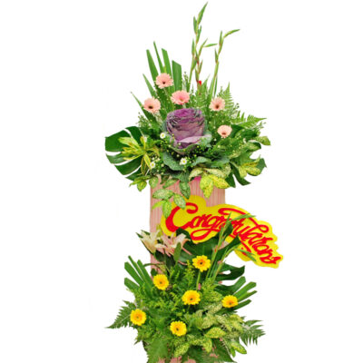 opening flower stand featuring brassica, gladiolus, stargazer lily and gerbera with lush greenery in a layered arrangement about 180cm tall.